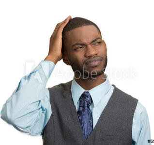 A man with his hand on his head, looking confused.
